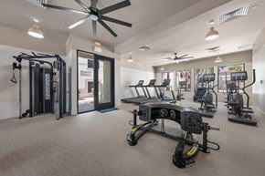 Glendale apartment for rent - A gym with a variety of equipment including treadmills, weights, and a rowing machine.